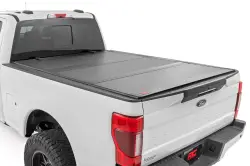 ROUGH COUNTRY Hard Tri-Fold Flip Up Bed Cover 6'10" Bed | Ford Super Duty (17-23)